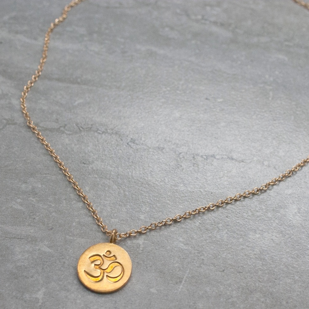Ôm gold pendant on chain